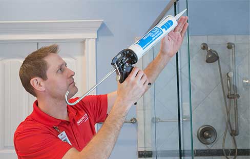 Glass Shower Doors & Tub Enclosure Installations Glass Doctor specialist installing a glass shower door