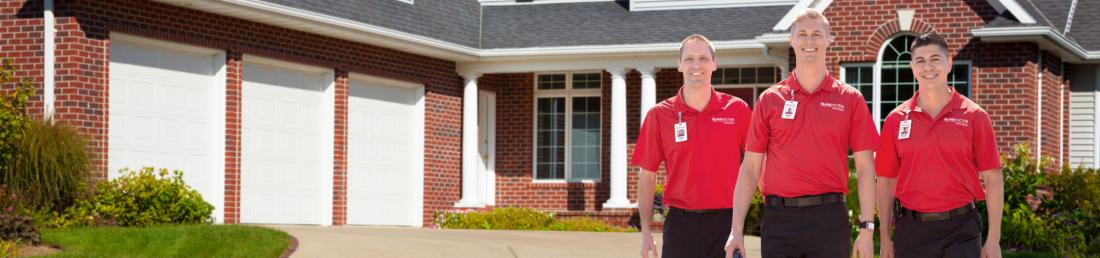 Glass Doctor specialists in front of a house